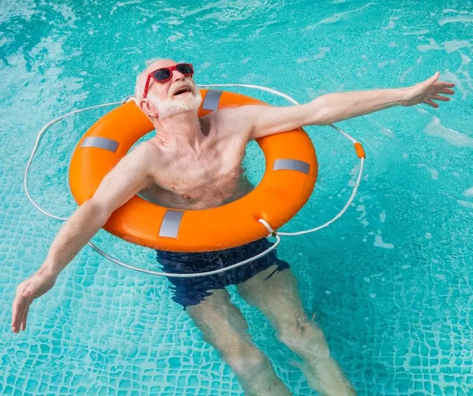 man-floating-in-swimming-pool-with-sunglasses